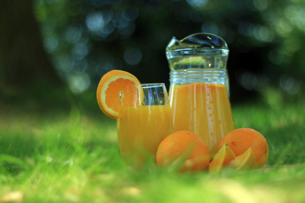 Orange juice in a glass pitcher
